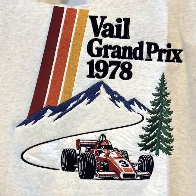 Actual Vail Grand Prix 1978 back embroidery — color-corrected close-up of the original lettering, stripes, mountains, evergreen and number 3 race car.
