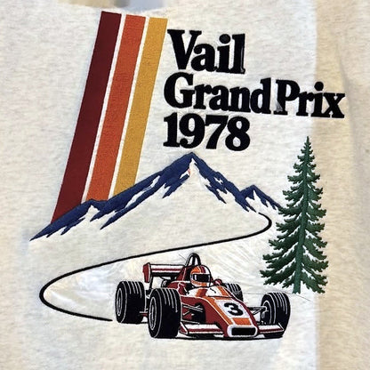 Actual Vail Grand Prix 1978 back embroidery — color-corrected close-up of the original lettering, stripes, mountains, evergreen and number 3 race car.